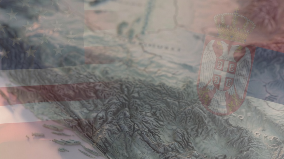 The flags of the US and Serbia overlayed over a mountain range.
